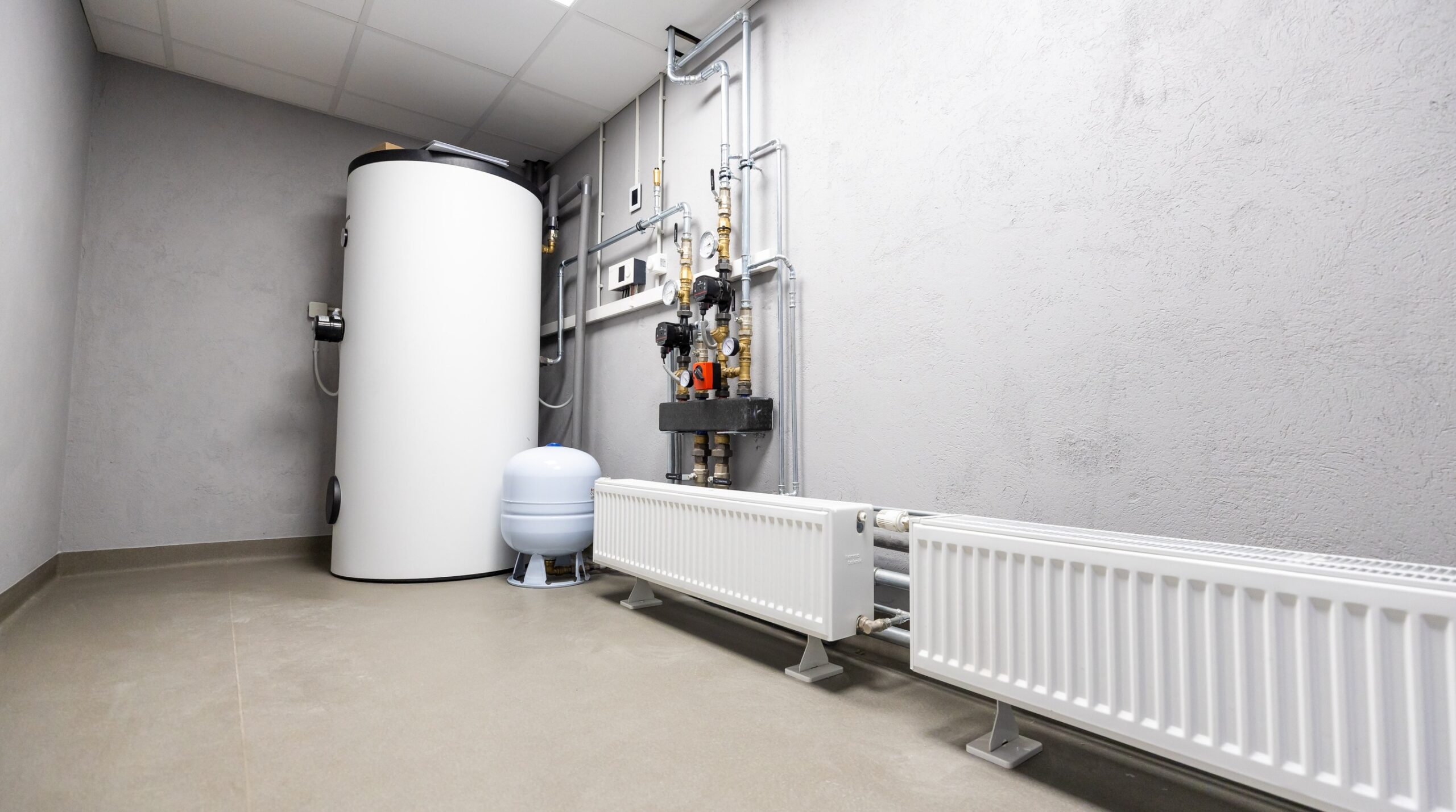 A correctly installed water heater comes with pressure-management hardware alongside it, not just the tank itself.