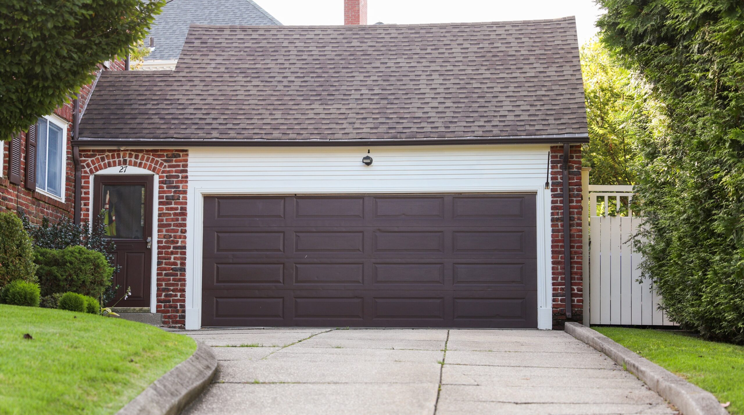 Hire a Garage Door Installer: What Springs, Openers, and a New Door Actually Cost